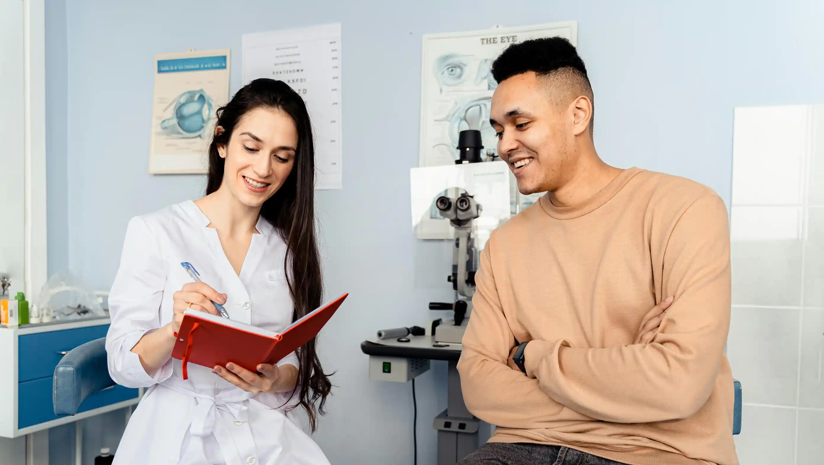 Optometrist talking with a patient